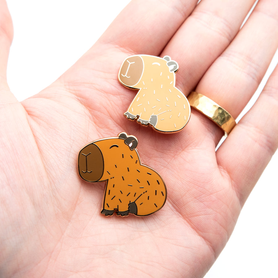 Handcrafted capybara lapel pins with lifelike details.