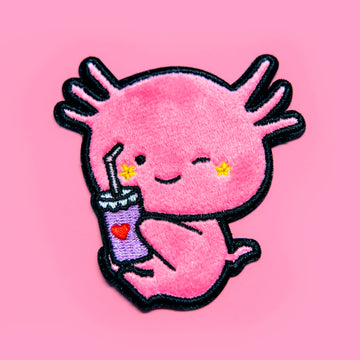 Axolotls: Nature's whimsical marvels, embodying regenerative prowess, stitched onto a soft minky patch.