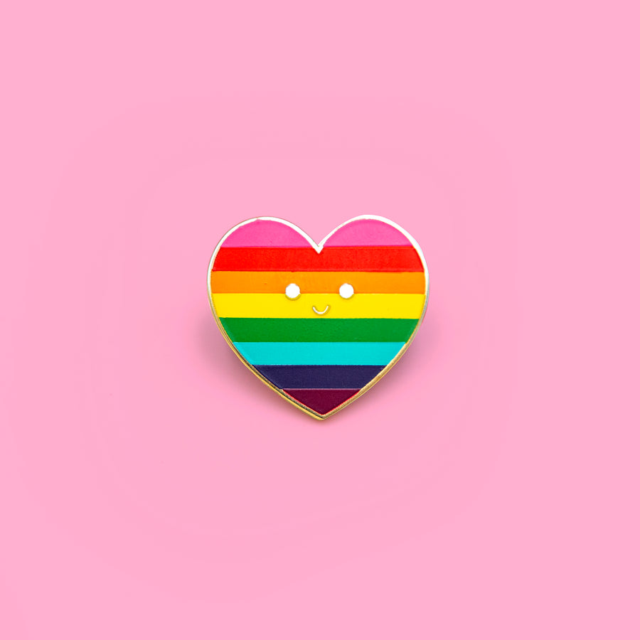Enamel pin of the Rainbow Flag designed by Gilbert Baker, featuring pink, red, orange, yellow, green, turquoise, blue, and violet colors representing various meanings