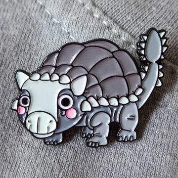 Ankylosaurus pin on gray sweater