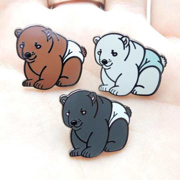 bear pins on hand close up