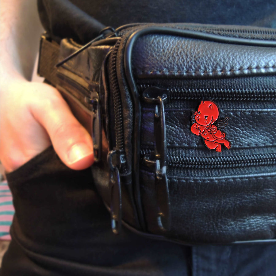red devil lapel pin on black leather pin